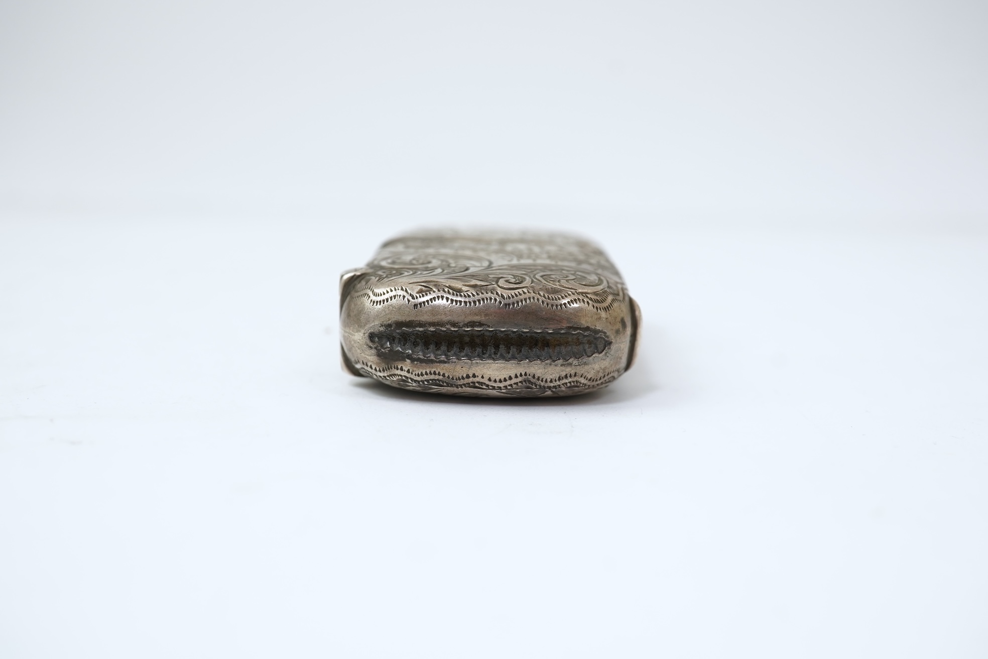 A late Victorian engraved silver oval combination sovereign and vesta case, by JW